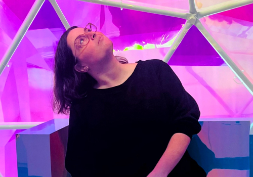 photo of woman in coloful geodesic dome